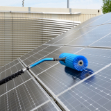 solar gooseneck for telescopic pole being used to cleaner solar panels